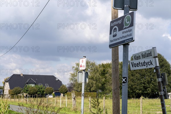 Neighbourhood protection sign against burglars, via WhatsApp groups, rural area near the village of Auwel near Straelen, North Rhine-Westphalia, Germany, Europe