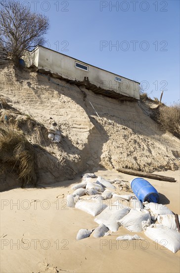 March 2018, Clifftop property collapsing due to coastal erosion after recent storm force winds, Hemsby, Norfolk, England, UK