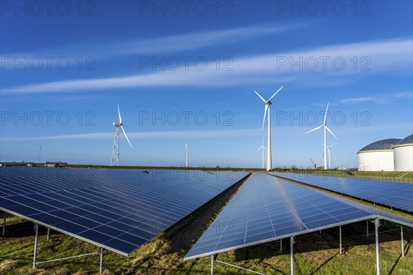 Vopak Solarpark Eemshaven, 19 hectares of solar modules with a capacity of 25 megawatts, around the Vopak tank terminal in the industrial harbour of Eemshaven, wind farm, Groningen, Netherlands