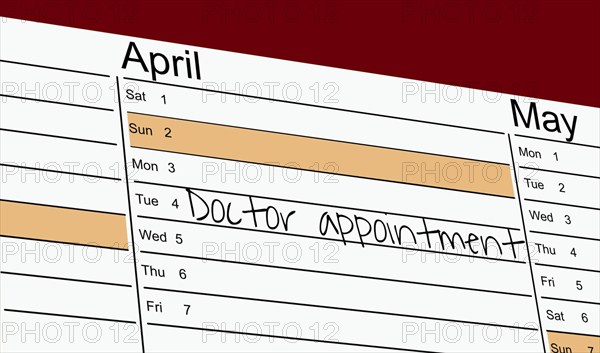 Symbolic image: Appointment diary with note for preventive medical check-up (English)