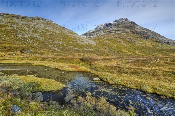 Autumn in Reinheimen National Park, mountains with river in Valldalen valley, Møre og Romsdal, Norway, Europe