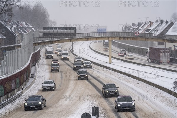 A40 motorway, onset of winter, lots of fresh snow and daytime temperatures below minus 5 degrees, uncleared road, little traffic, poor road conditions, Essen, North Rhine-Westphalia, Germany, Europe