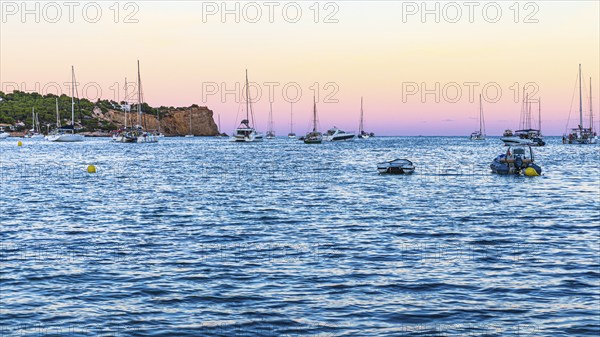 Sailing yachts at the blue hour in the bay of Talamanca, Eivissa, Ibiza Town, Ibiza, Balearic Islands, Mediterranean Sea, Spain, Europe