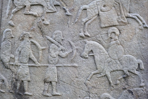 Detail of battle scene on the rear of the Aberlemno Kirkyard Cross Slab, a Pictish stone in Scotland