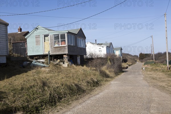 March 2018, Clifftop property just inland from homes collapsing due to coastal erosion after recent storm force winds, Hemsby, Norfolk, England, UK