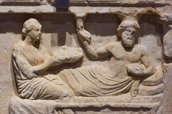 Votive relief, Honouring a hero, Ancient relief of two figures in a reclining scene, carved from stone, Archaeological Museum, Archea Korinthos, Corinth, Peloponnese, Greece, Europe