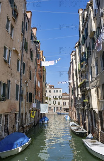 Clotheslines across a canal in the Cannaregio district, Venice, Veneto, Italy, Europe