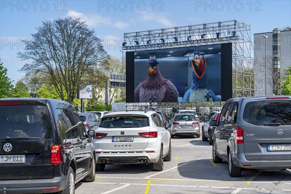 Temporary drive-in cinema, in the car park in front of Messe Essen, Grugahalle, large LED screen also allows film screenings in the sunshine, family film, effects of the corona crisis in Germany