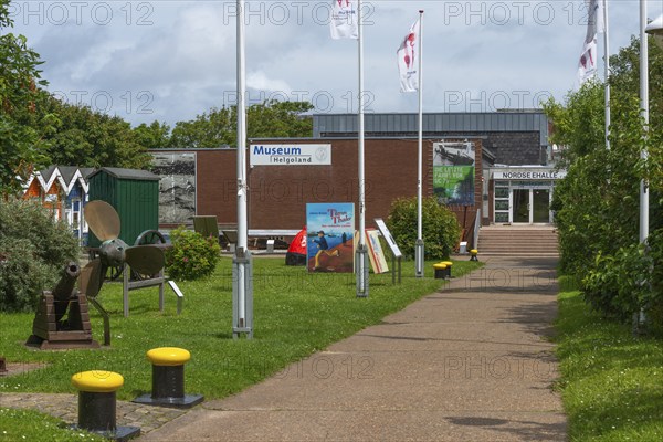 Museum in the North Sea Hall in Unterland, outdoor area with lobster shacks and maritime elements, ship's propeller, historic cannon, bollard, path, offshore island of Heligoland, North Sea, Pinneberg district, Schleswig-Holstein, Germany, Europe