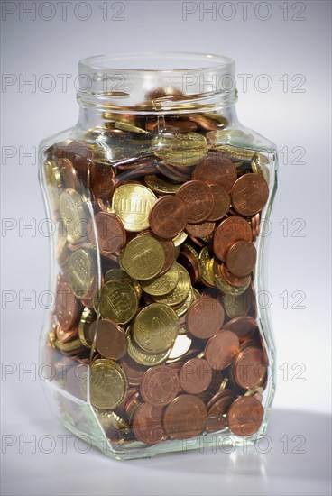 Euro coins in a jar