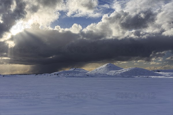 Cloudy mood and snowstorm over an old volcano, snow, winter, Neshraun, Snaefellsnes, Vesturland, Iceland, Europe