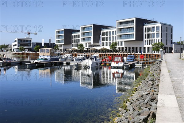 Marina Hafen Graf Bismarck, the converted and newly built harbour of the former Graf Bismarck colliery. The cleared colliery site is being built on with a housing estate of detached houses and apartment blocks, Gelsenkirchen, 13.06.2021