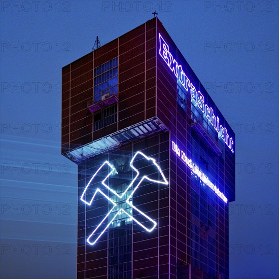 Illuminated hammerhead tower of Heinrich Robert colliery for the Extra Shift, Ost colliery, Hamm, Ruhr area, North Rhine-Westphalia, Germany, Europe