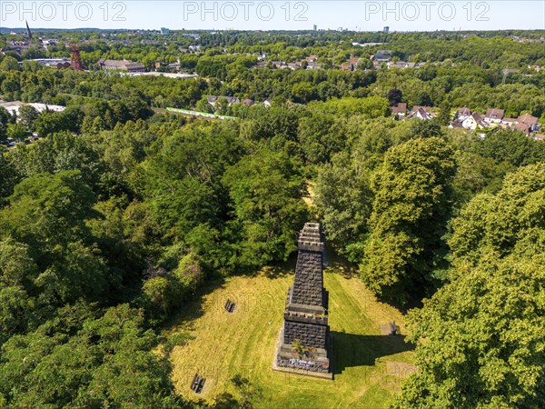 The Mechtenberg in Essen, one of the few natural elevations from the ice age in the Ruhr area, was once 100 metres above sea level, but due to mining subsidence it is now only around 80 metres above sea level, Bismarck Column, view to the west towards Essen, part of the Mechtenberg Landscape Park, North Rhine-Westphalia, Germany, Europe