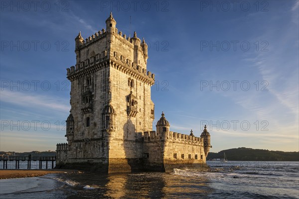 Belem Tower or Tower of St Vincent, famous tourist landmark of Lisboa and tourism attraction, on the bank of the Tagus River Tejo on sunset. Lisbon, Portugal, Europe