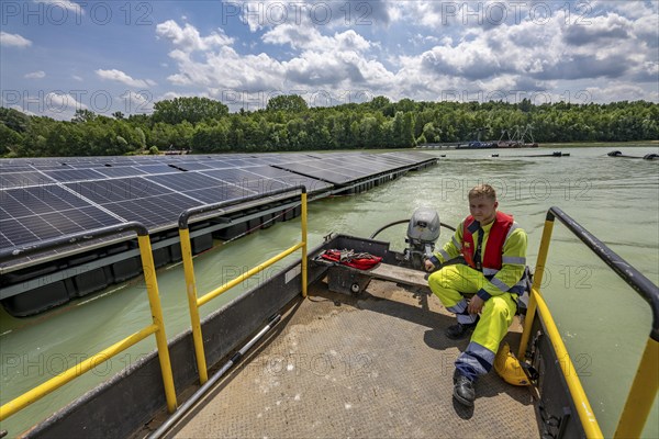 Germany's largest floating solar power plant on the Silbersee III, a quarry pond no longer used for sand mining, near Haltern am See, operated by Quarzwerke GmbH, around 5800 solar modules, on an area of a good 2 football pitches, generate 3.1 megawatts of power, the company uses the electricity itself on weekdays, at weekends it flows into the public grid, North Rhine-Westphalia, Germany, Europe