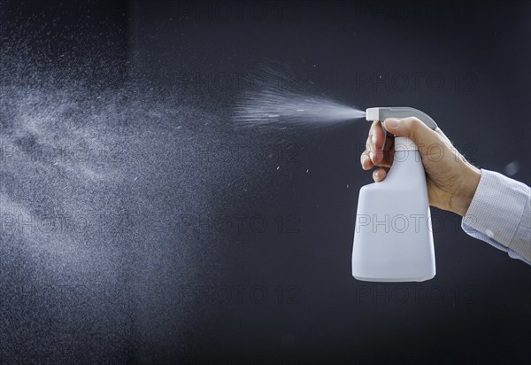 A man sprays a liquid into the air in Berlin, 09/08/2024