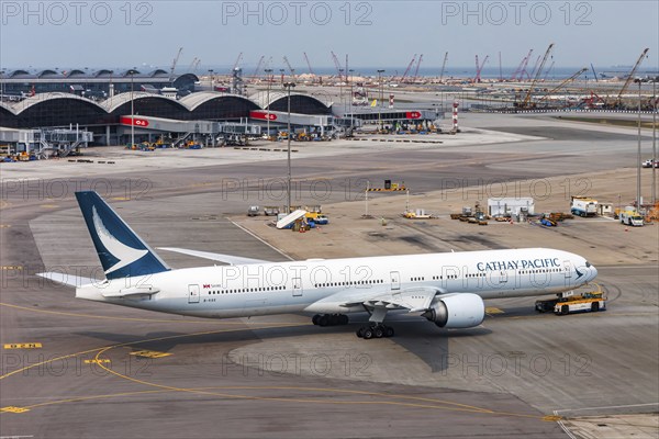 A Cathay Pacific Boeing 777-300ER aircraft with registration B-KQX at Chek Lap Kok Airport (HKG) in Hong Kong, China, Asia