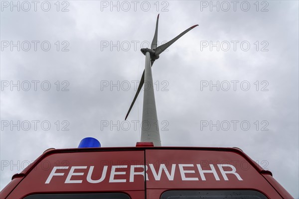 Height rescuers from the Oberhausen fire brigade practise abseiling from a wind turbine from a height of 150 metres in rainy weather, Issum, North Rhine-Westphalia, Germany, Europe