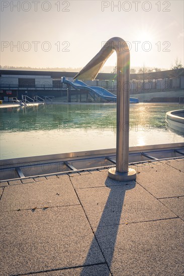 Outdoor pool with an outdoor shower in the shining sunlight, ENCW outdoor pool Calw, Stammheim, Black Forest, Germany, Europe