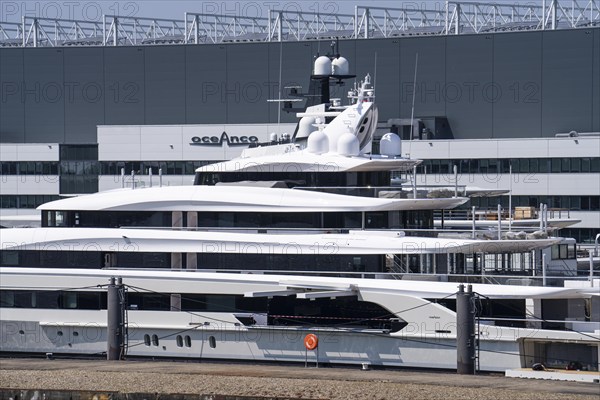 Oceanco shipyard in Alblasserdam, specialising in the construction of mega yachts, luxury yachts, on the river Noord, South Holland, in front the H3 yacht, 105 metres long, completely renovated, rebuilt, behind the superyacht Seven Seas Yacht, 109 metres long, owned by Steven Spielberg, Netherlands