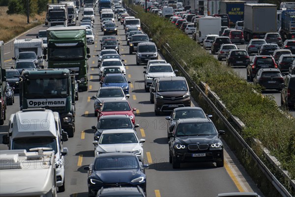 Traffic jam on the A3 motorway, over 8 lanes, in both directions, between the Leverkusen motorway junction and the Cologne-Mülheim junction, looking south, Friday afternoon heavy traffic, delays due to the traffic jam, Leverkusen, North Rhine-Westphalia, Germany, Europe