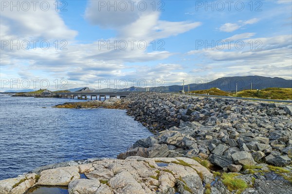 Bridge connecting rocky shores under a cloudy sky, autumn, Atlantic Road, Atlanterhavsveien, Romsdal, Norway, Europe