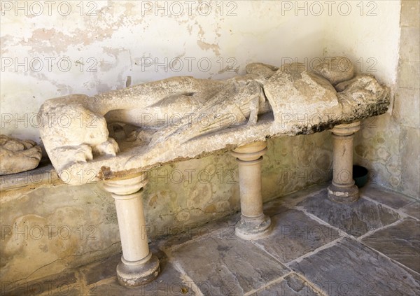 Stone effigy of knight in porch of Church of Saint Michael and All Angels, Figheldean, Wiltshire, England, UK