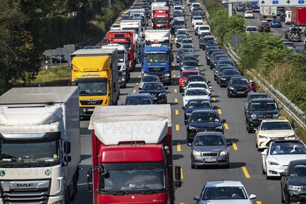 Traffic jam on the A3 motorway, over 8 lanes, in both directions, in front of the Leverkusen motorway junction, Friday afternoon high traffic volume, roadworks, Leverkusen, North Rhine-Westphalia, Germany, Europe