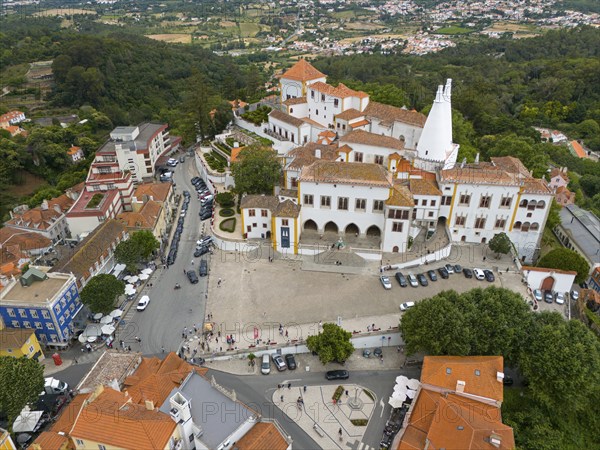 Aerial view of a historic palace surrounded by urban buildings and green areas, Royal Palace, Palácio Nacional de Sintra, National Palace, Sintra, Lisbon, Portugal, Europe