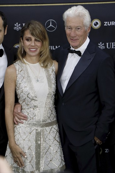 Richard Gere with woman Alejandra Gere at the premiere of Wisdom of Happiness, A heart-to-heart with the Dalai Llama as part of the 20th Zurich Film Festival, Zurich, 08.10.2024