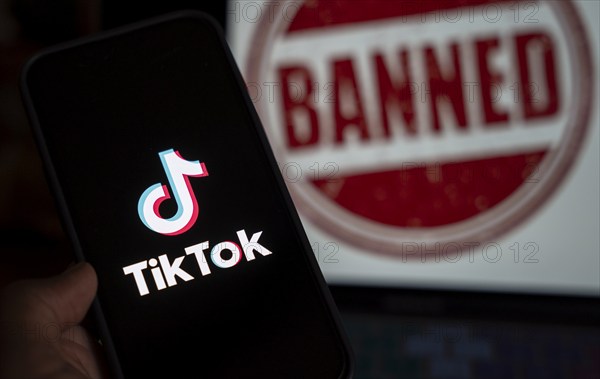 In this photo illustration, logo of Tiktok is displayed on mobile phone screen next to ban sign, in Guwahati, India 25 April 2024. US President Joe Biden signs law to ban Chinese-owned TikTok unless sold to US company