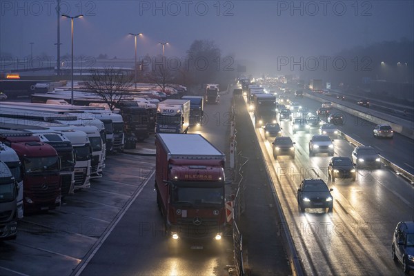 Heavy traffic on the A2 at the Bottrop-Süd service area, overcrowded lorry parking in the evening, Bottrop, North Rhine-Westphalia, Germany, Europe