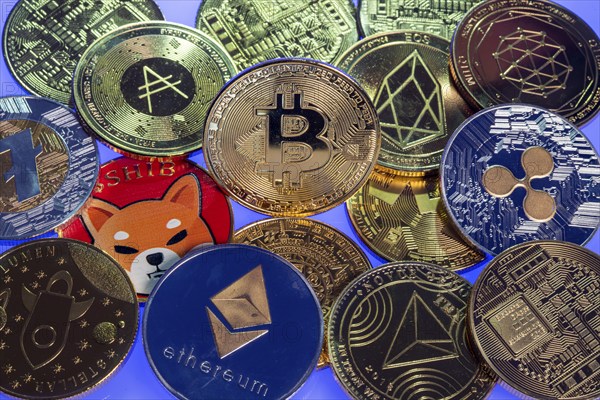 Various cryptocurrencies, symbol coins, optical placeholder for the digital currency, blockchain, Bitcoin, Ripple, Ethereum, Shiba Inu, Eos, Litecoin, Monero, Stellar, Adalevea, Qtum Blockchain, Tron, Maya