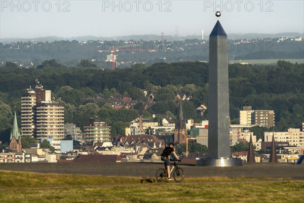 View of the city centre, skyline of Herne, over the Hoheward spoil tip, obelisk of the sundial, North Rhine-Westphalia, Germany, Europe