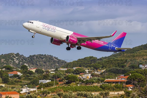 A Wizzair Airbus A321neo aircraft with the registration 9H-WAI at Skiathos Airport, Greece, Europe