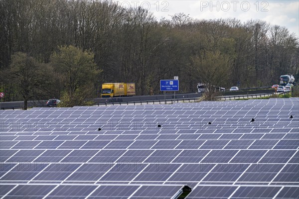 Solar park near Neukirchen-Vluyn, along the A40 motorway, over 10, 000 solar modules spread over 4.2 hectares, generating 6 million kilowatt hours per year, North Rhine-Westphalia, Germany, Europe