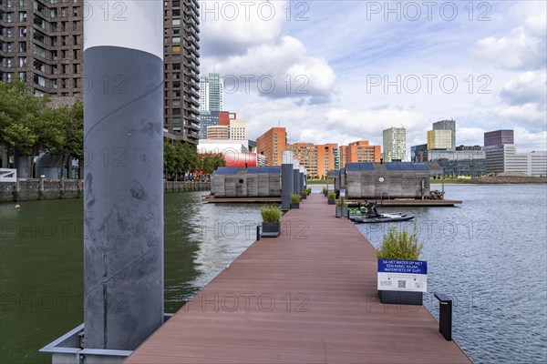 Floating hotel rooms, Wikkelboat in the Rijnhaven, the Rijnhaven, a 28-hectare harbour basin, has now been filled in by almost a third to create space for up to 3, 000 flats, there will be an artificial beach, a floating park connected by jetties, restaurants and shops, cultural facilities, a major urban development project in the old harbour, the Rijnhaven borders on the popular Kop van Zuid and Katendrecht districts, Rotterdam, Netherlands