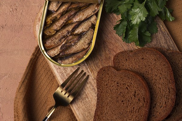 Preserves, sprats with black bread, top view, no people