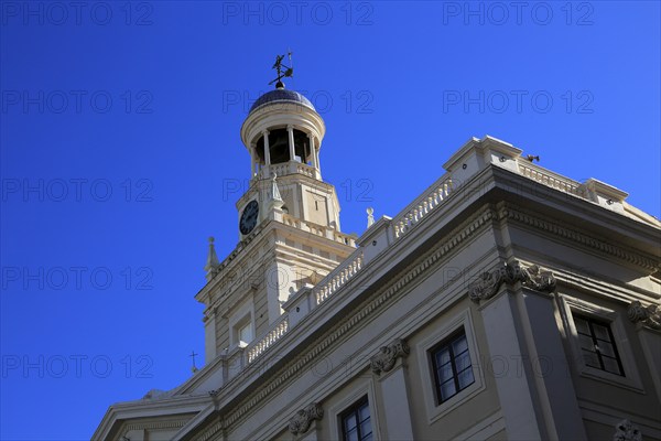 Looking up at tower and blue sky of Ayuntamiento city hall building, Cadiz, Spain, Europe