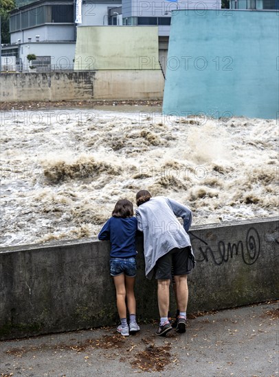 Weir of the Lake Baldeney in Essen, the masses of water roar through the open weirs, spectators, onlookers, high water on the Ruhr, after long heavy rains the river came out of its bed and flooded the landscape and villages, the highest water level ever measured, North Rhine-Westphalia, Germany, Europe