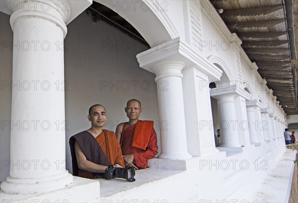 Buddhist monks in the Dambulla cave temple, Dambulla, Central Province, Sri Lanka, Asia