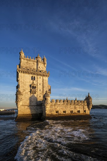 Belem Tower or Tower of St Vincent, famous tourist landmark of Lisboa and tourism attraction, on the bank of the Tagus River Tejo on sunset. Lisbon, Portugal, Europe