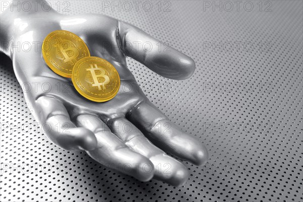 Bitcoin BTC cryptocurrency on silver futuristic hand