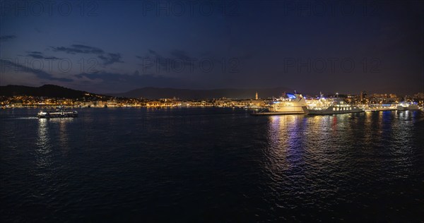 Harbour at night, illuminated ships with their light reflections in the water, Split, Dalmatia, Croatia, Europe