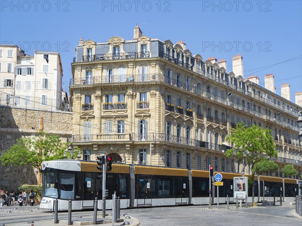 Many cities in France have introduced modern tram networks in recent years. Situation in Marseille, France, with a modern tram car in front of historic housing blocks formerly used as factories, Europe