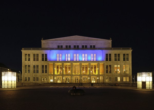 Leipzig Opera in the evening in the colours of Ukraine. Leipzig, Saxony, Germany, Europe