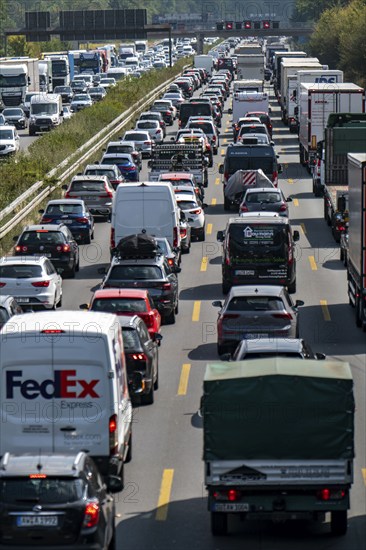 Traffic jam on the A3 motorway, over 8 lanes, in both directions, between the Leverkusen motorway junction and the Cologne-Mülheim junction, looking south, Friday afternoon heavy traffic, delays due to the traffic jam, Leverkusen, North Rhine-Westphalia, Germany, Europe