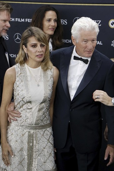 Richard Gere with woman Alejandra Gere at the premiere of Wisdom of Happiness, A heart-to-heart with the Dalai Llama as part of the 20th Zurich Film Festival, Zurich, 08.10.2024