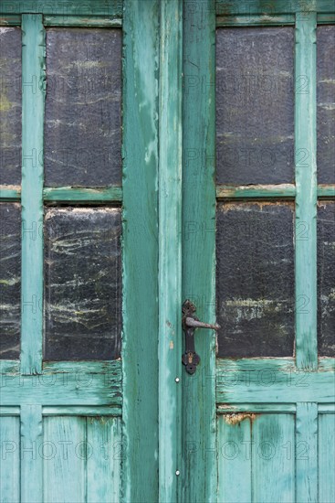 Old dilapidated turquoise door, detail, transom window, wood, wooden door, colour, peeled off, green, entrance door